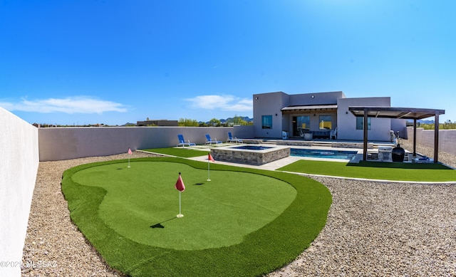 view of yard featuring a fenced backyard, a pool with connected hot tub, and a patio area