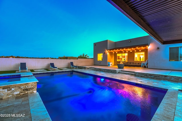 view of swimming pool with a fenced in pool, a patio, fence, and an outdoor kitchen