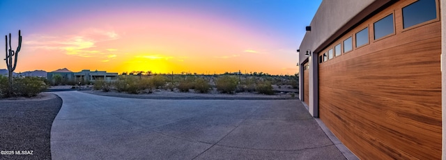 exterior space featuring concrete driveway
