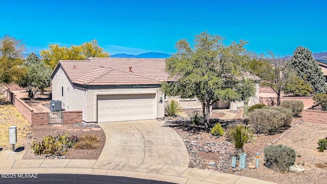 4661 S Desert Grove Ct, Green Valley, AZ 85622 - view of front facade with a tile roof, central air condition unit, driveway, a garage, and stucco siding