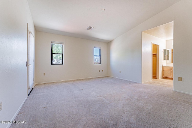 4661 S Desert Grove Ct, Green Valley, AZ 85622 - empty room featuring visible vents, baseboards, and light carpet