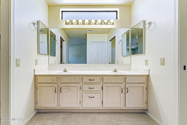 4661 S Desert Grove Ct, Green Valley, AZ 85622 - bathroom featuring a wealth of natural light, baseboards, a sink, and double vanity