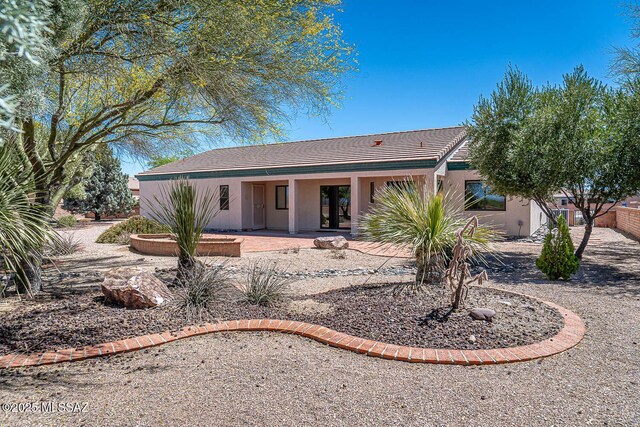 4661 S Desert Grove Ct, Green Valley, AZ 85622 - view of front of house featuring stucco siding