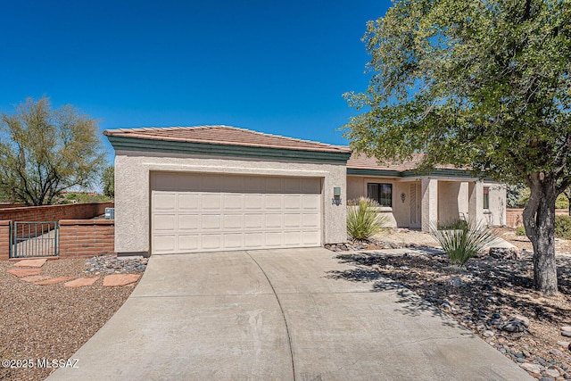4661 S Desert Grove Ct, Green Valley, AZ 85622 - single story home with a garage, driveway, fence, and stucco siding