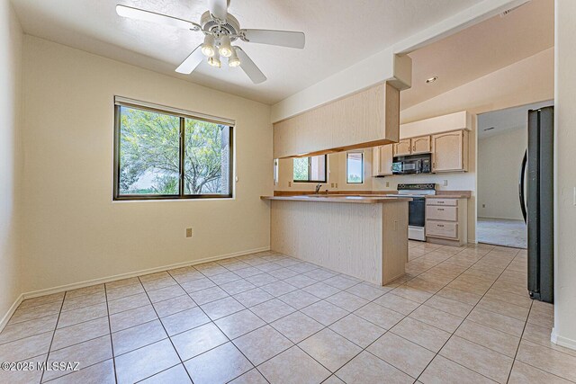 4661 S Desert Grove Ct, Green Valley, AZ 85622 - kitchen with a peninsula, light tile patterned flooring, ceiling fan, light brown cabinets, and black appliances