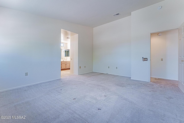 4661 S Desert Grove Ct, Green Valley, AZ 85622 - spare room with visible vents, baseboards, and light carpet