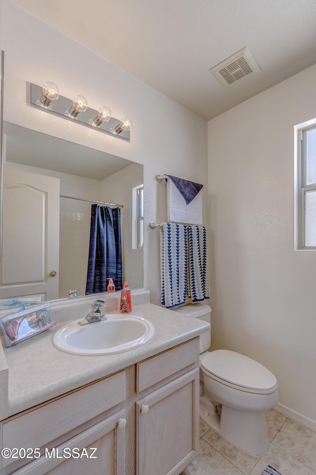 full bathroom with vanity, toilet, a shower with shower curtain, tile patterned floors, and visible vents