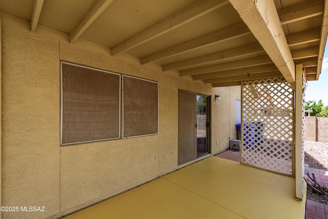 view of patio / terrace featuring fence