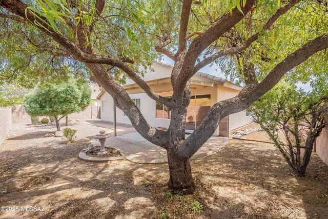 3856 W Argo St, Tucson, AZ 85742 - view of front of house with a patio, stucco siding, and a fenced backyard