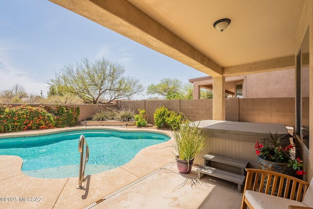434 E Via Puente De La Lluvia, Sahuarita, AZ 85629 - view of swimming pool featuring a hot tub, a fenced backyard, and a patio