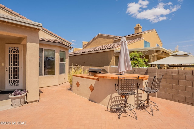 434 E Via Puente De La Lluvia, Sahuarita, AZ 85629 - view of patio / terrace with an outdoor bar and area for grilling