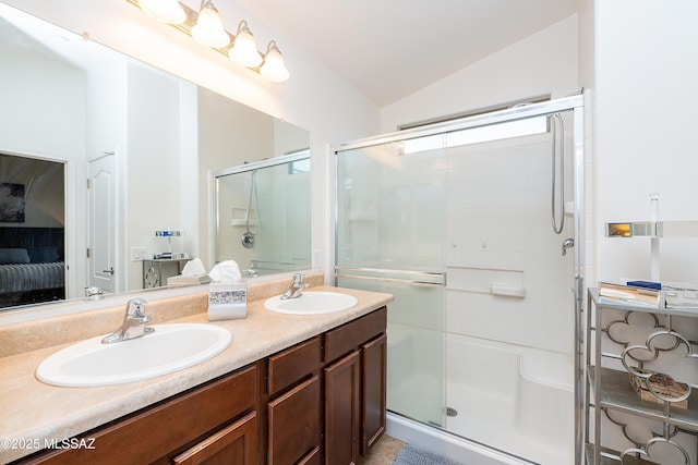 61080 Halter Pl, Saddlebrooke, AZ 85739 - full bathroom featuring a sink, connected bathroom, a stall shower, and vaulted ceiling