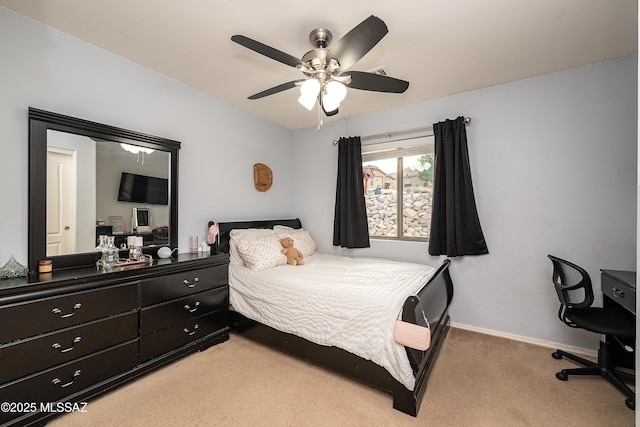 61080 Halter Pl, Saddlebrooke, AZ 85739 - bedroom with light carpet, baseboards, and ceiling fan