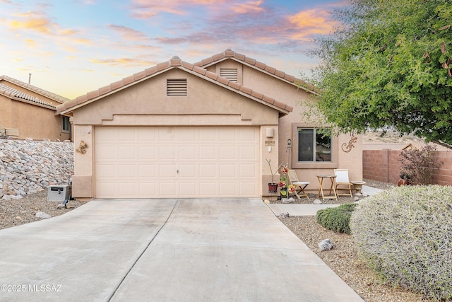 61080 Halter Pl, Saddlebrooke, AZ 85739 - single story home featuring fence, driveway, stucco siding, and an attached garage