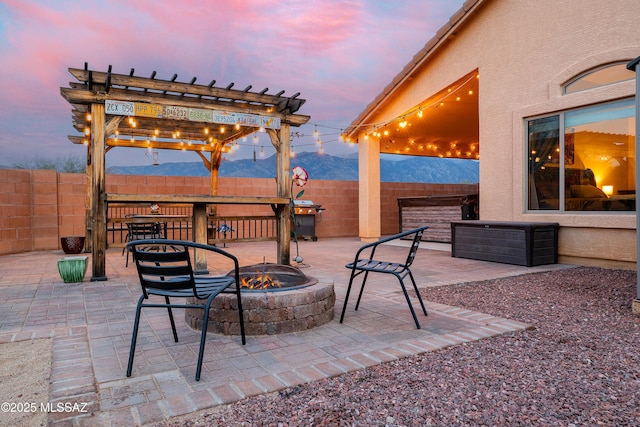 61080 Halter Pl, Saddlebrooke, AZ 85739 - view of patio with an outdoor fire pit, a pergola, and fence