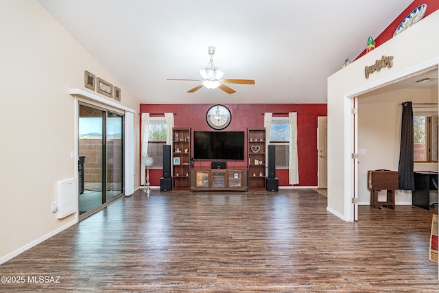 61080 Halter Pl, Saddlebrooke, AZ 85739 - living area with a healthy amount of sunlight, wood finished floors, baseboards, and a ceiling fan