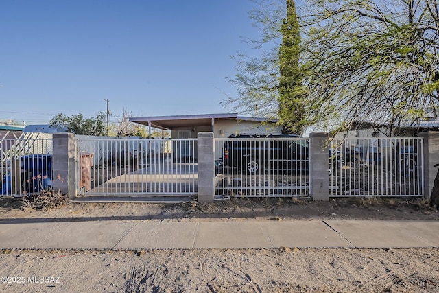 view of gate featuring a fenced front yard