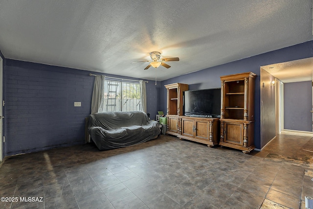 unfurnished living room featuring a textured ceiling and a ceiling fan