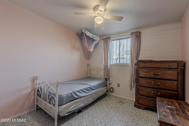 bedroom featuring baseboards and a ceiling fan