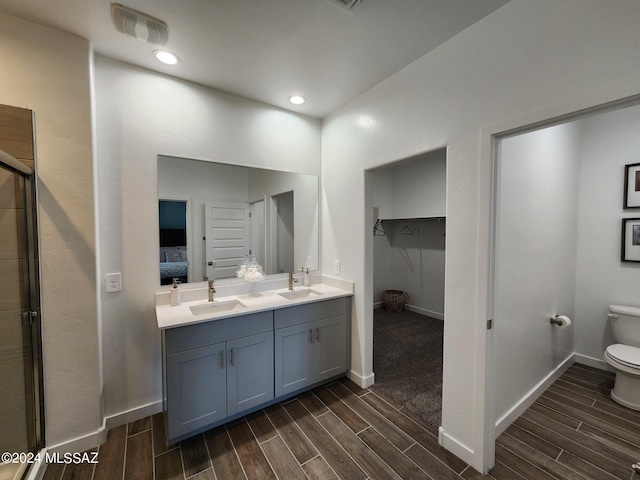14023 E Canidae Dr E, Vail, AZ 85641 - ensuite bathroom featuring wood tiled floor, visible vents, and a sink