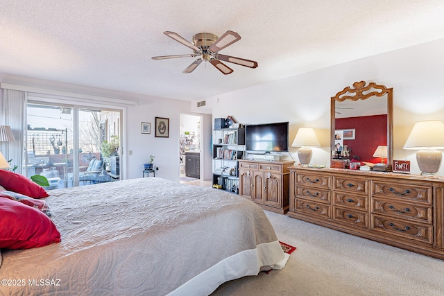 carpeted bedroom featuring a ceiling fan, access to exterior, visible vents, and a textured ceiling