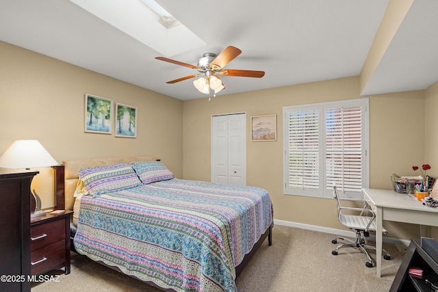carpeted bedroom featuring baseboards, ceiling fan, and a closet
