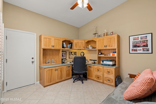 office space with a ceiling fan, light tile patterned flooring, and built in study area