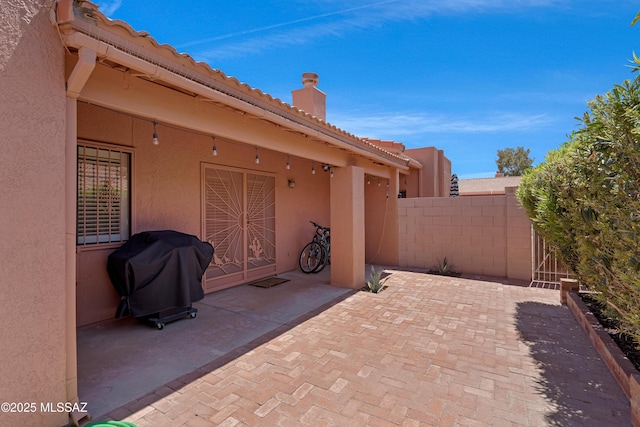 view of patio / terrace with fence and area for grilling