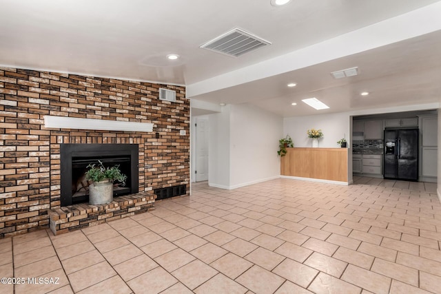 5914 E Beverly St, Tucson, AZ 85711 - unfurnished living room featuring recessed lighting, baseboards, and visible vents
