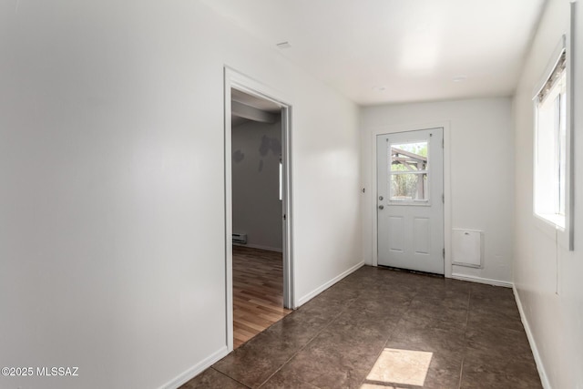 5914 E Beverly St, Tucson, AZ 85711 - doorway to outside featuring baseboards and a baseboard radiator