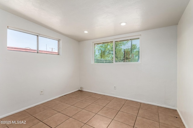 5914 E Beverly St, Tucson, AZ 85711 - unfurnished room featuring recessed lighting, baseboards, and light tile patterned floors