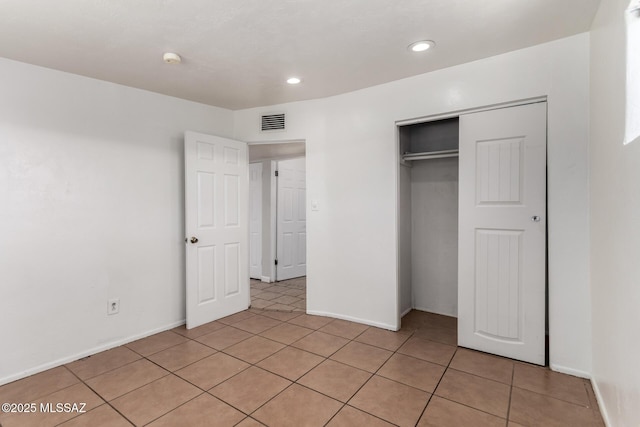 5914 E Beverly St, Tucson, AZ 85711 - unfurnished bedroom with visible vents, a closet, baseboards, recessed lighting, and light tile patterned floors