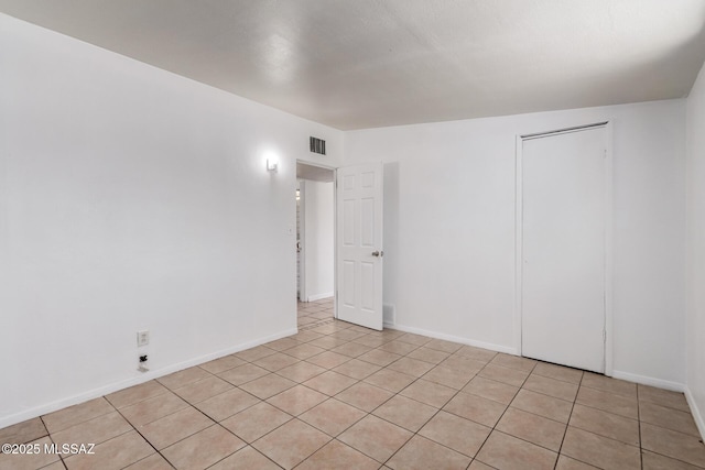 5914 E Beverly St, Tucson, AZ 85711 - unfurnished room featuring light tile patterned flooring, baseboards, and visible vents