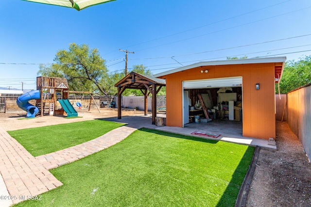 5914 E Beverly St, Tucson, AZ 85711 - view of yard featuring a fenced backyard, an outdoor structure, a gazebo, and a playground
