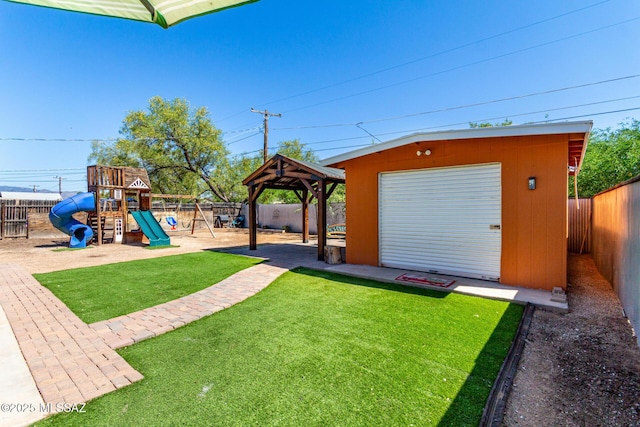 5914 E Beverly St, Tucson, AZ 85711 - view of yard with a fenced backyard, an outbuilding, a gazebo, and a playground