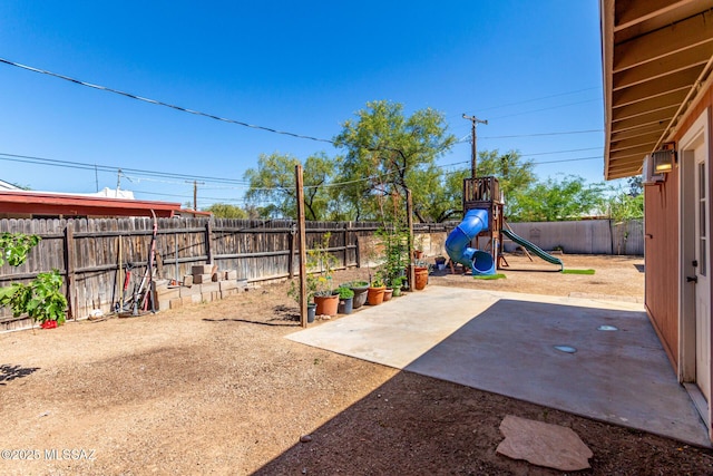 5914 E Beverly St, Tucson, AZ 85711 - view of yard featuring a playground, a patio area, and a fenced backyard