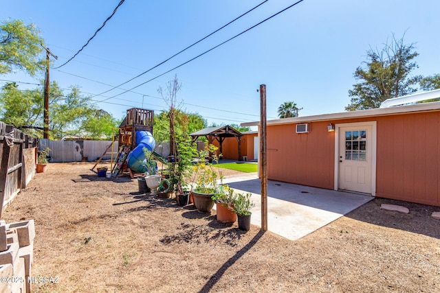 5914 E Beverly St, Tucson, AZ 85711 - view of yard featuring a playground, a patio, and fence private yard