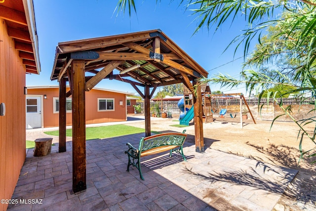 5914 E Beverly St, Tucson, AZ 85711 - view of patio / terrace with a fenced backyard and a playground