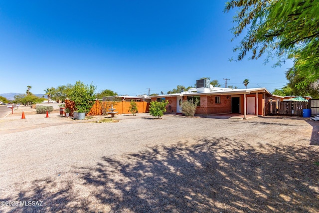 5914 E Beverly St, Tucson, AZ 85711 - view of front of property with fence and an attached carport