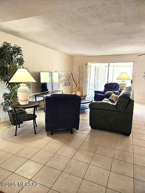 341 W Rio-Santa Cruz, Green Valley, AZ 85614 - living area featuring light tile patterned floors and a textured ceiling