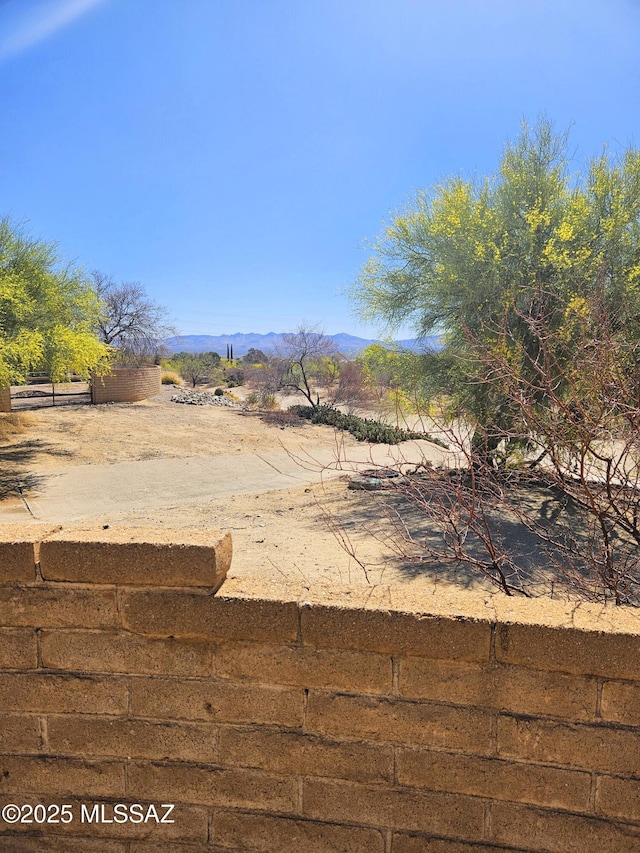 341 W Rio-Santa Cruz, Green Valley, AZ 85614 - view of yard with a mountain view and fence