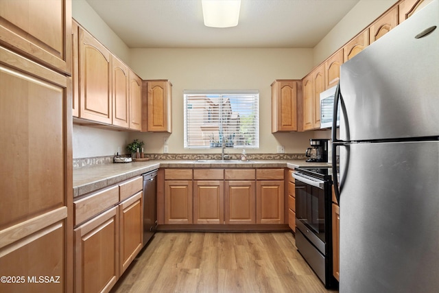 7050 E Sunrise Dr Unit 1104, Tucson, AZ 85750 - kitchen featuring appliances with stainless steel finishes, a sink, light wood-style flooring, light countertops, and light brown cabinetry