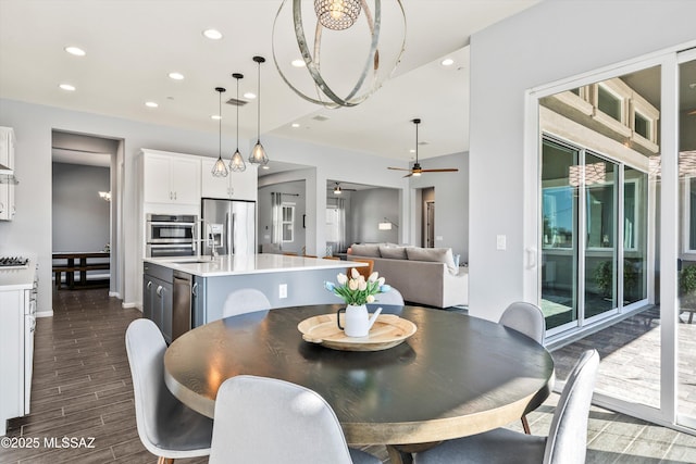 7415 W Cactus Flower Pass, Marana, AZ 85658 - dining room featuring a ceiling fan, dark wood-type flooring, recessed lighting, and baseboards