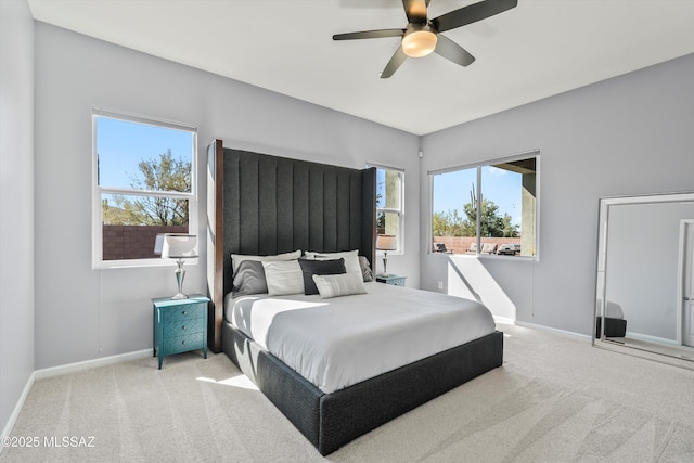 7415 W Cactus Flower Pass, Marana, AZ 85658 - bedroom with carpet flooring, baseboards, multiple windows, and ceiling fan