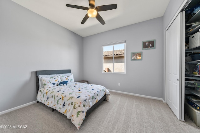 7415 W Cactus Flower Pass, Marana, AZ 85658 - carpeted bedroom with baseboards, a closet, and ceiling fan
