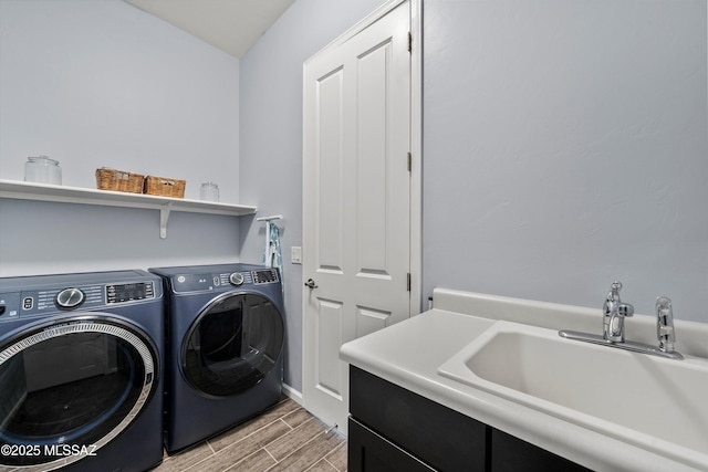 7415 W Cactus Flower Pass, Marana, AZ 85658 - laundry area featuring washing machine and dryer, wood tiled floors, cabinet space, and baseboards
