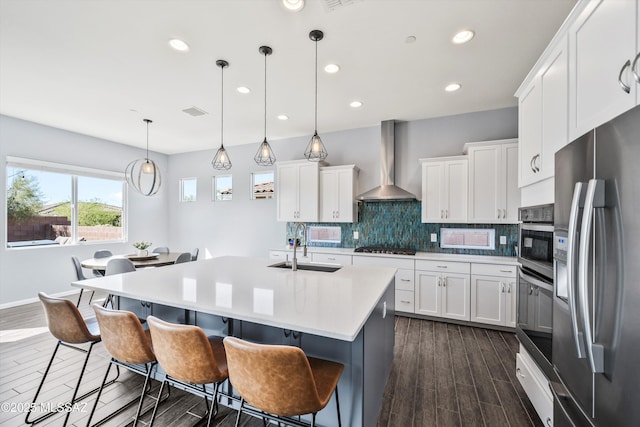 7415 W Cactus Flower Pass, Marana, AZ 85658 - kitchen featuring stainless steel fridge with ice dispenser, wall chimney range hood, a sink, dark wood-type flooring, and decorative backsplash