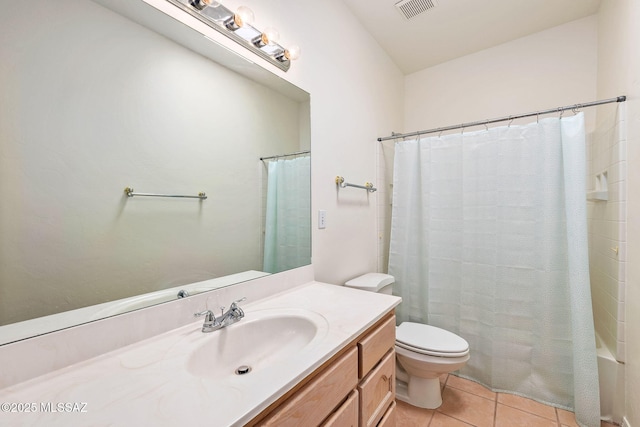 bathroom with visible vents, toilet, tile patterned flooring, and vanity
