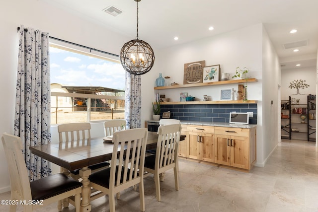 dining room with visible vents, recessed lighting, and a chandelier