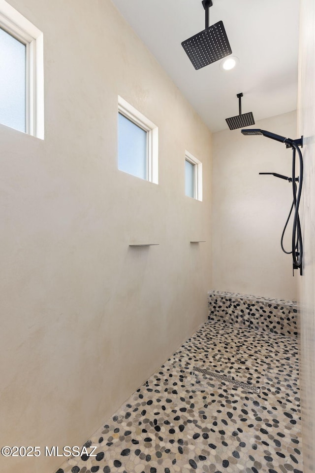 bathroom featuring tiled shower